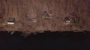 Flying over cabins in 4K video