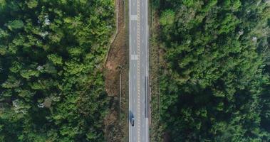 Aerial view country road in forest video