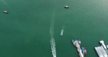 Aerial view of speed boats on the sea near beach city video