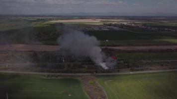 Drone flying towards a fire in 4K video