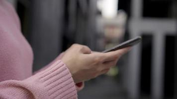 Cheerful Asian backpacker blogger woman using smartphone for direction. video