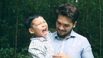 Dad and son have a happy time in nature. video