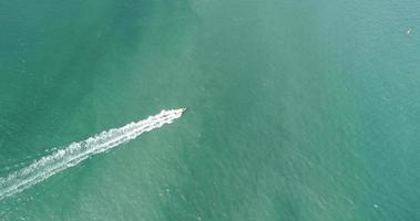 Aerial view of speed boats on the sea near beach city, Pattaya, Thailand. video