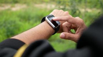 Hand touching on screen of smart watch video