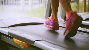 Woman running on a treadmill video