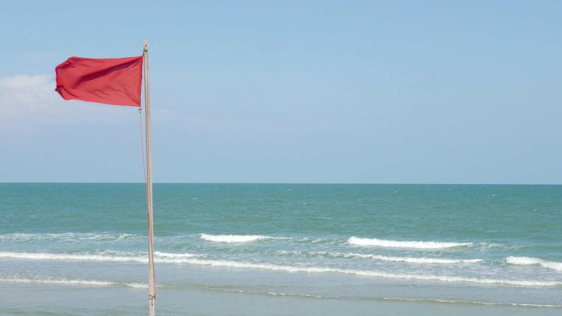 Fluttering Red Flag At The Beach 1623341 Stock Video at Vecteezy