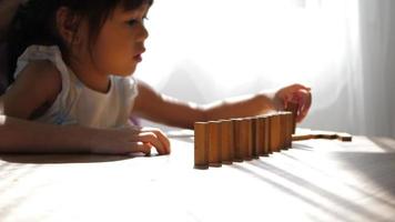 Grandmother And Granddaughter Play With Jenga Blocks video