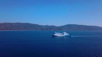 Drone flying towards a ferry in 4K video