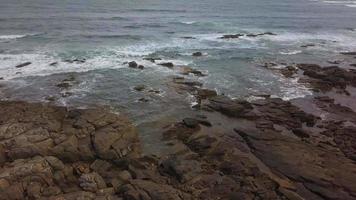 Aerial View Of Ocean Waves And Rocky Coast video