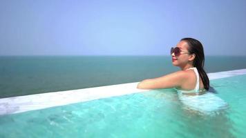 Young Woman Relaxing In A Swimming Pool video