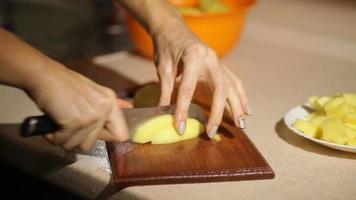 Slicing Potatoes On A Wooden Board video