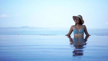 Young Woman Relaxing In A Swimming Pool video