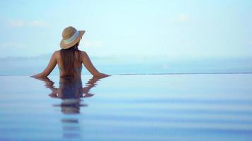 Back view of Woman in swimming pool  video