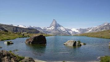 Matterhorn with alpine lake, Stellisee, Switzerland, Europe video