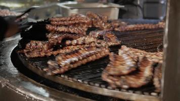 Cookers Grilling Pork Ribs on Rotating Grill video