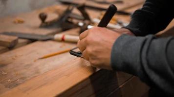 Carpenter Marks the Workpiece with a Square and a Marking Knife video