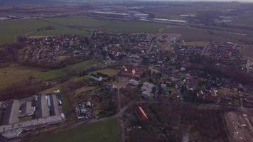 Aerial view of a village with a chateau in 4K video