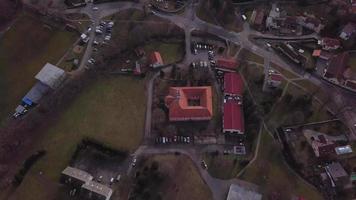 Aerial top down view of a chateau in a village in 4K video