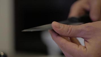 Man's Finger Touches a Sharp Knife video