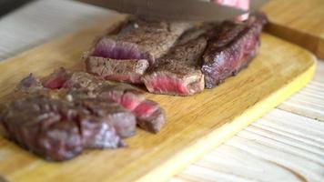 Slicing grilled beef steak video