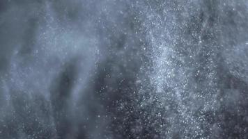 partículas de polvo blanco bailando en el aire video