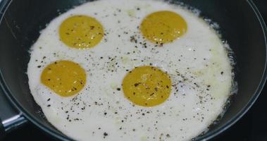 Fried eggs cooked in a pan video