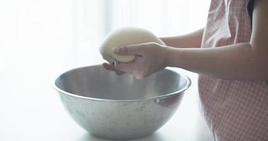 Woman hand kneading dough video