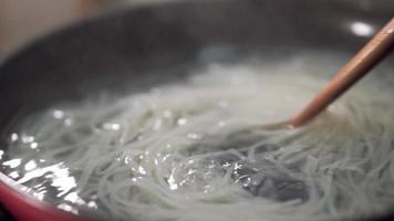 Boiling noodles and preparing for a healthy meal video