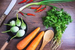 Vegetables on wooden background photo