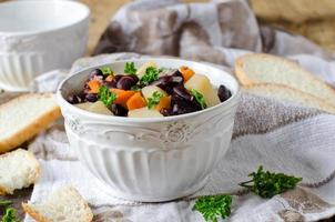 Bean stew with vegetables and meat photo