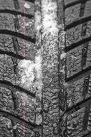 Car tire profile with snow and rain photo