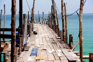 Traditional wooden bridge on the beach. photo