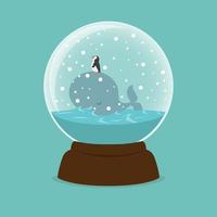 ballena y pingüino dentro de un globo de nieve