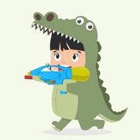 lindo niño disfrazado de cocodrilo con pistola de agua vector