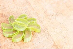 Aloe vera on wooden background photo