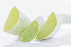 Sliced aloe vera on white background photo