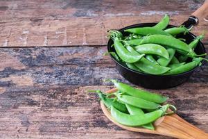 Fresh green peas in the pan. photo