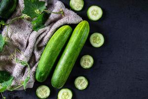 Chopped cucumbers on a towel photo