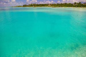 Maldives, South Asia, 2020 - Turquoise water at a tropical island photo