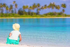 Girl playing by the water photo