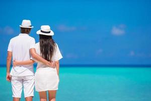 Couple looking at the ocean during the day photo