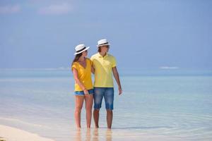 Couple enjoying the beach during the day photo