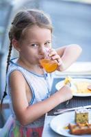 Girl drinking juice photo