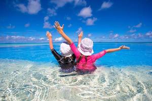 Two girls in a swimming pool photo