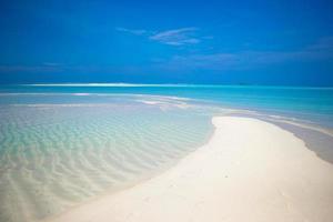 Sand bar in tropical water photo