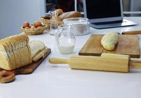Bread dough and rolling pin photo