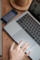 Close-up of woman working on laptop photo