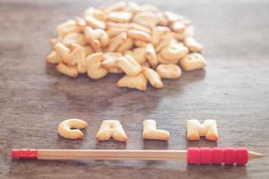 Calm alphabet biscuits with a pencil photo