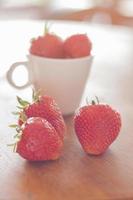 Group of strawberries in a cup photo