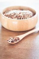 Organic rice in a wooden bowl photo